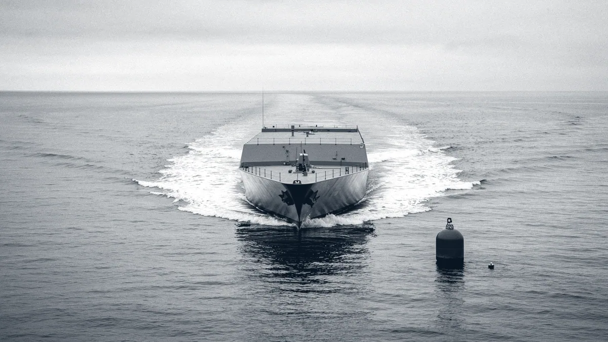 Illustration: A destroyer warship cutting through grey open water, its hull slicing a clean wake.